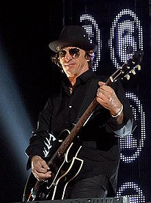Izzy Stradlin with a guitar