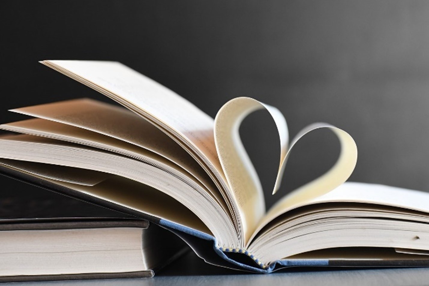 Book with its pages folded to make a heart