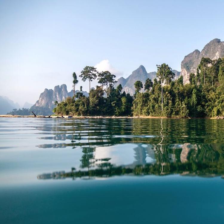 A tropical island with mountains in the background