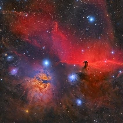 Image of nebulae with intense crimson and orange colour.