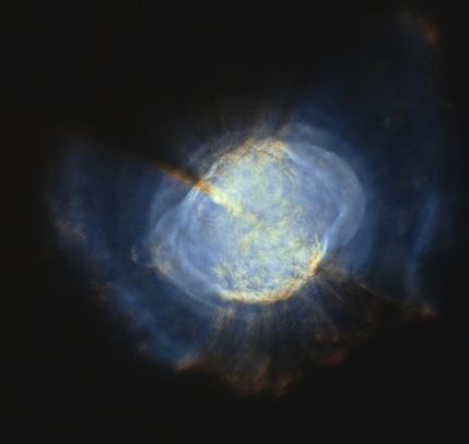 Cloud-like celestial object (Messier 27 - Dumbbell Nebula) with bright blue and yellow hues surrounded by faint gases.