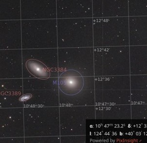 A star map showing three galaxies labeled M105, NGC 3384, and NGC 3389 against a dark sky background with coordinate grid lines.