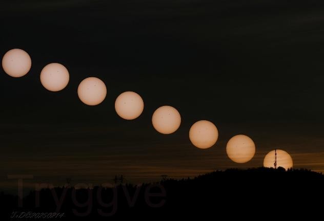 Image showing multiple shots of the setting sun stacked in one photograph, showing the process of the sun setting in one frame.