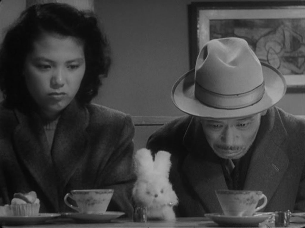 Scene from 'Ikiru', where a man and a woman are at a coffee shop