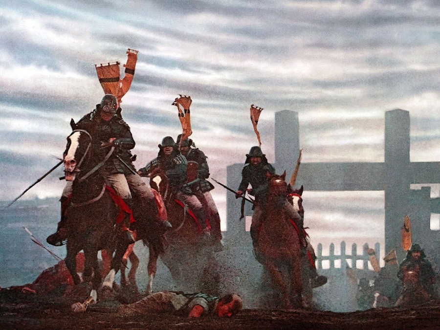 Scene from 'Ran', showing samurai riding horses on a battlefield