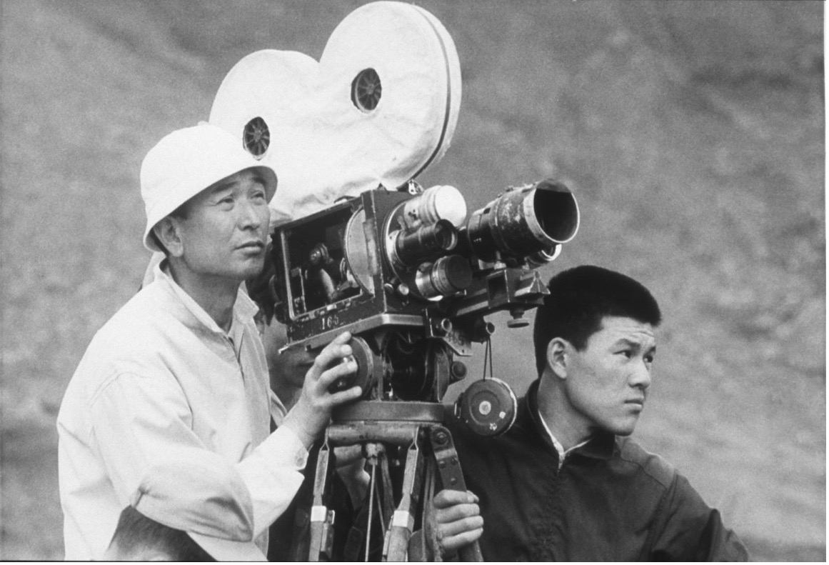 Young Akira Kurosawa holding a camera