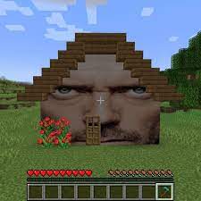 An image of the developer of the game, Gregory House, superimposed onto a house built in the videogame Minecraft