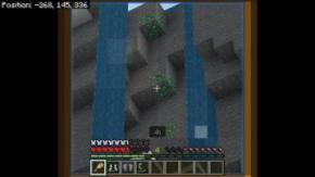Minecraft játékból kép, két folyó vízoszlop között van három függőleges zöld smaragdérc